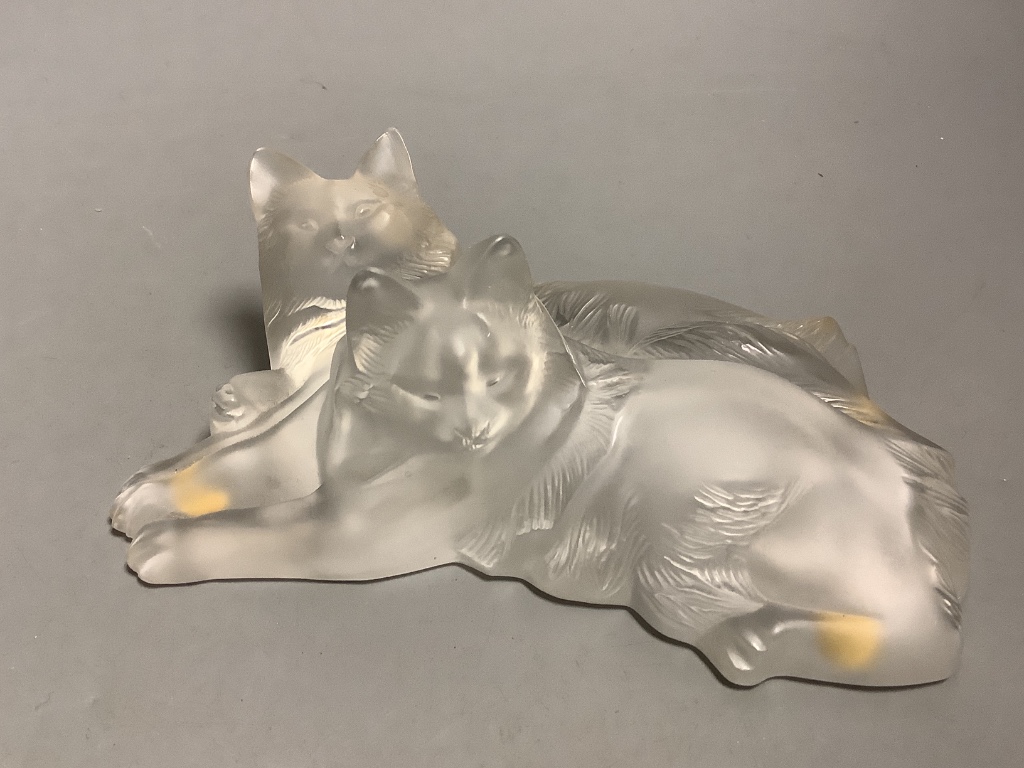 A Lalique model of two recumbent cats and a blue glass Daum rose